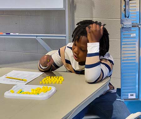 student sitting at a table